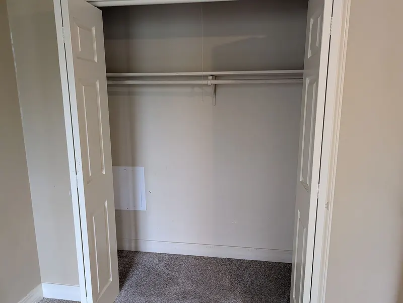 Closet with double doors and hanging rod